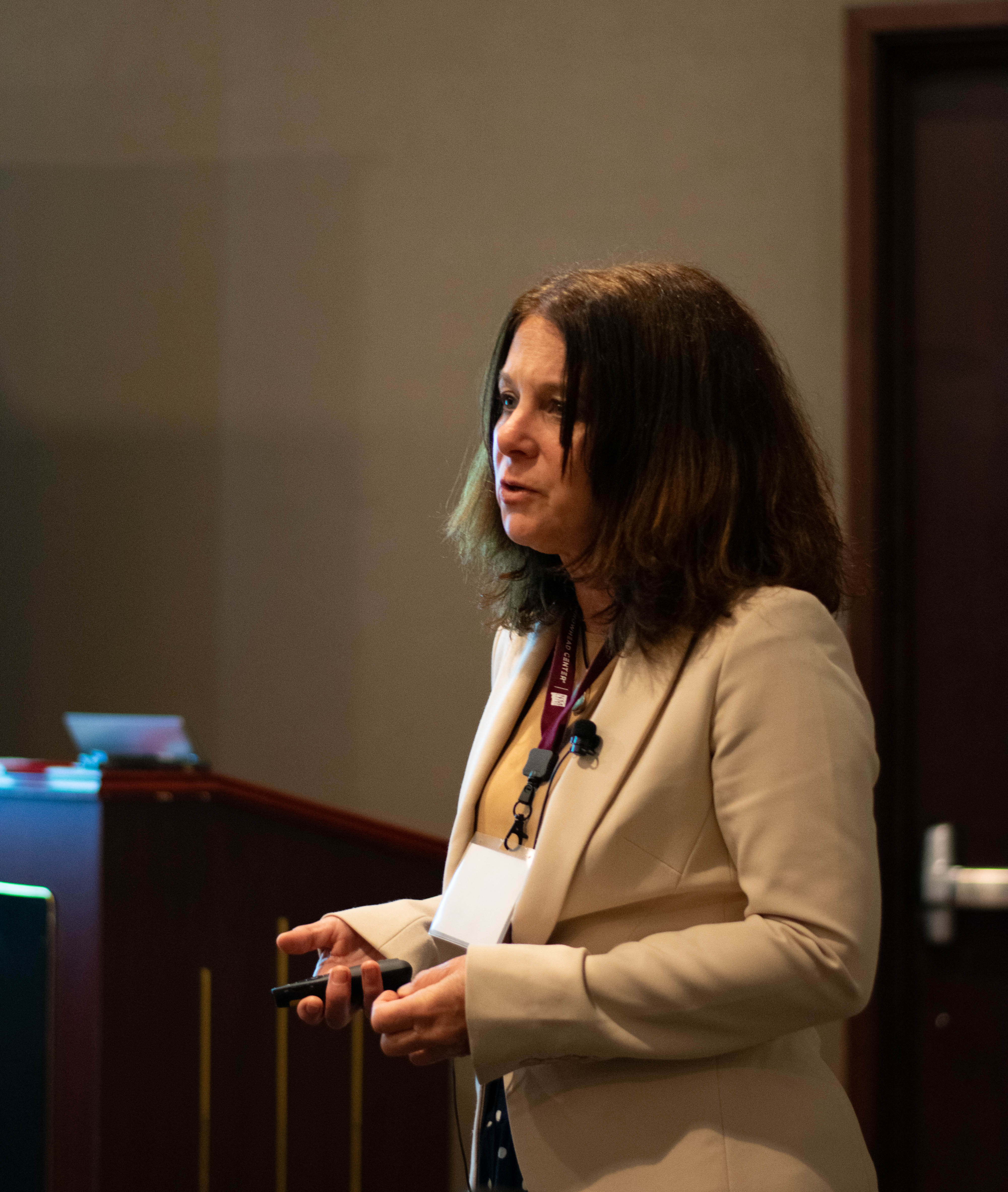 A woman speaking at a podium