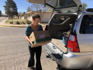 Woman unloads food donation
