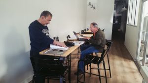two men working at a table